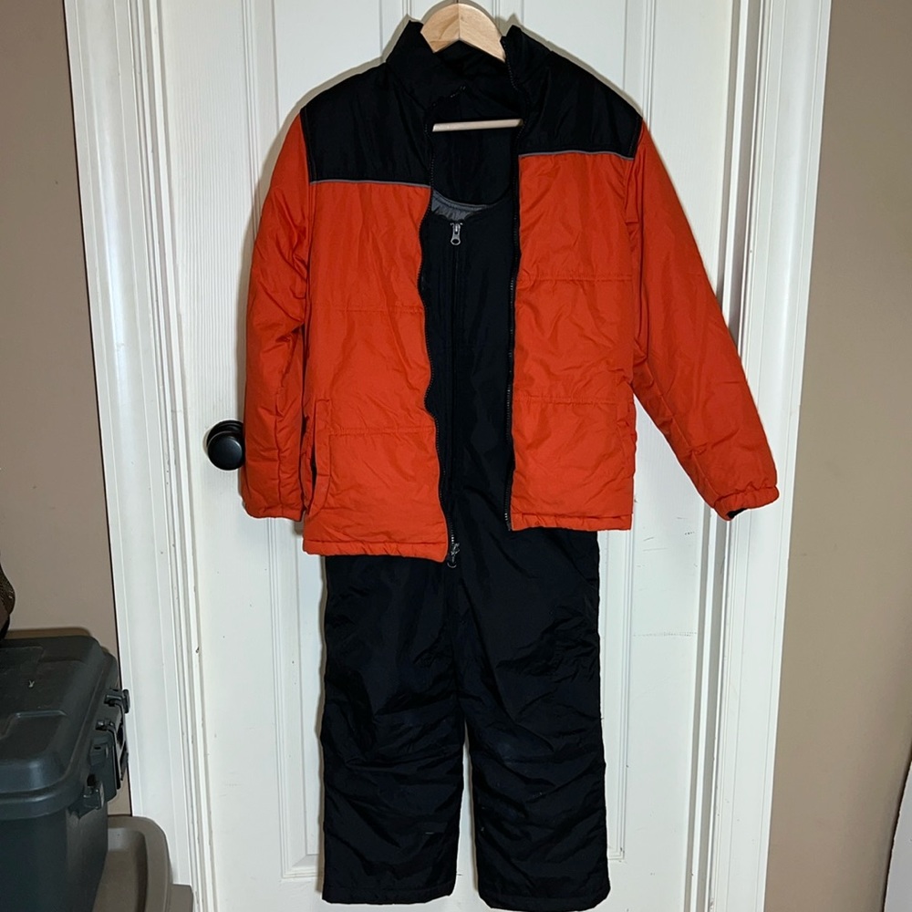 Kids snow bibs and jacket, size medium. Orange and black.